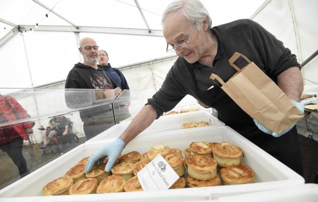 Kerr Little serving pies at a market